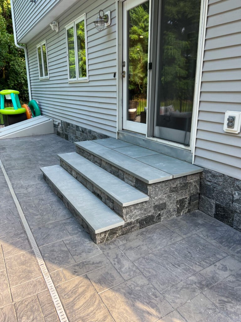Stone veneer front steps by AQ Masonry LLC in Connecticut