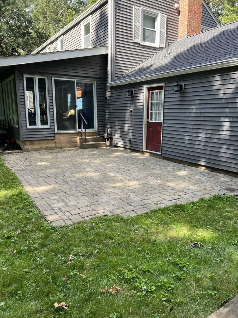 Before: worn, uneven paver patio in Simsbury, CT