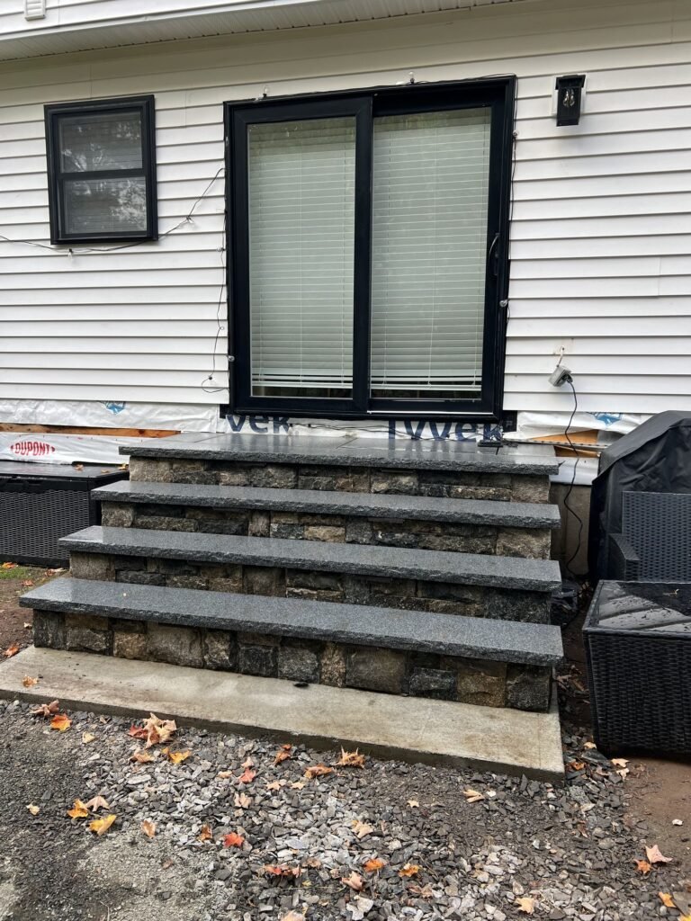 Bluestone steps with stone veneer risers in Hamden, CT