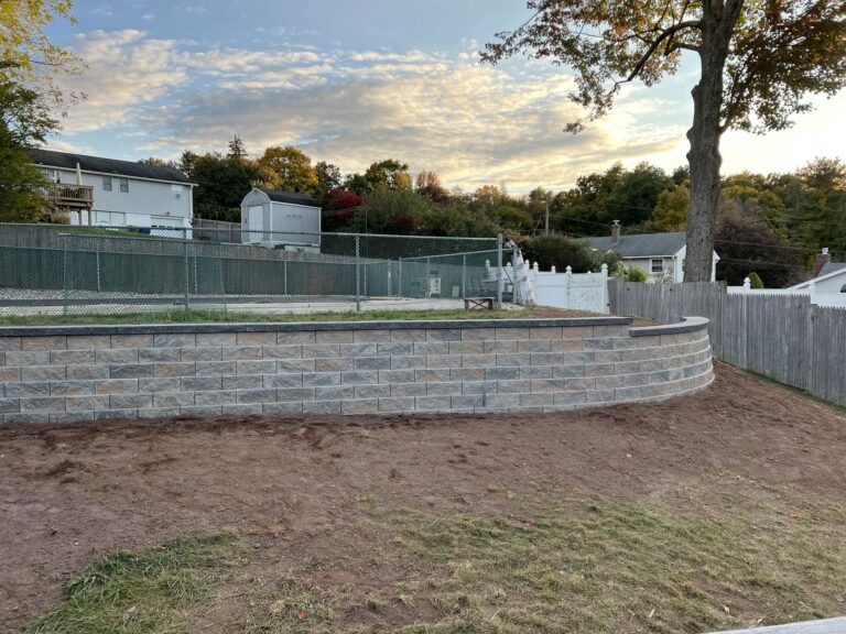Blog Curved block retaining wall around a raised backyard in Waterbury, CT