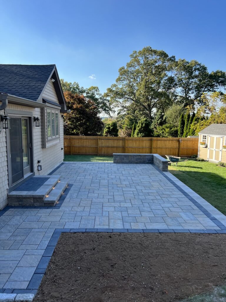 L-shaped paver patio with a dark border in Wallingford, CT