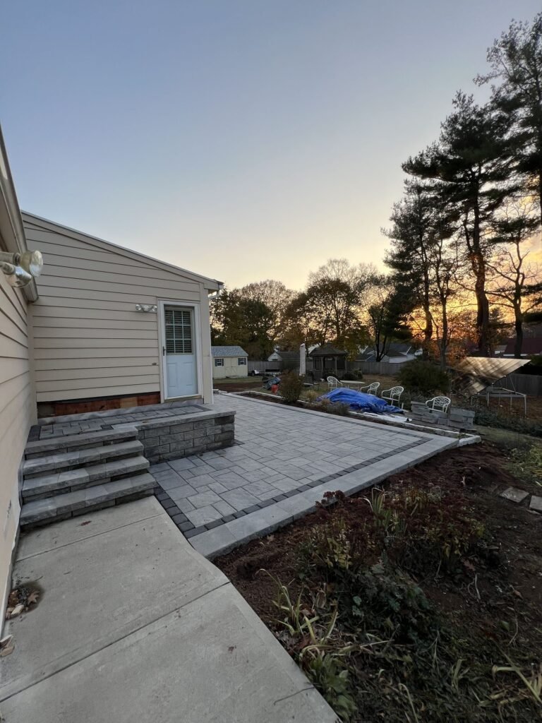 Finished paver patio and steps at sunset in North Haven, CT