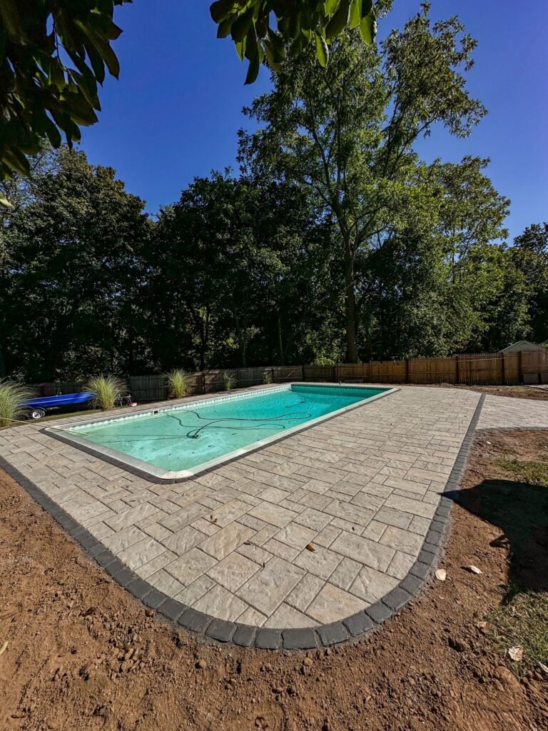 Paver pool patio around an in-ground pool in North Haven, CT